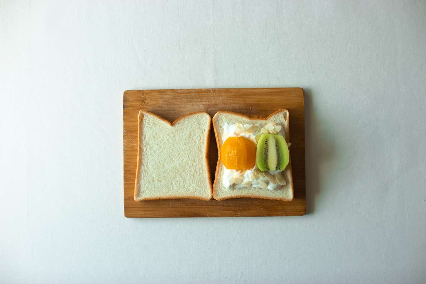 Fruit and cream sandos with orange, kiwi fruit and almonds
